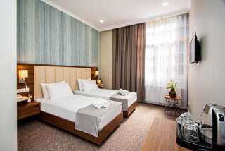 Отель Hotel Margi Тбилиси Стандартный двухместный номер с 2 отдельными кроватями-1